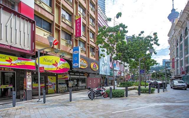 Capital O Hotel Grand Orchard