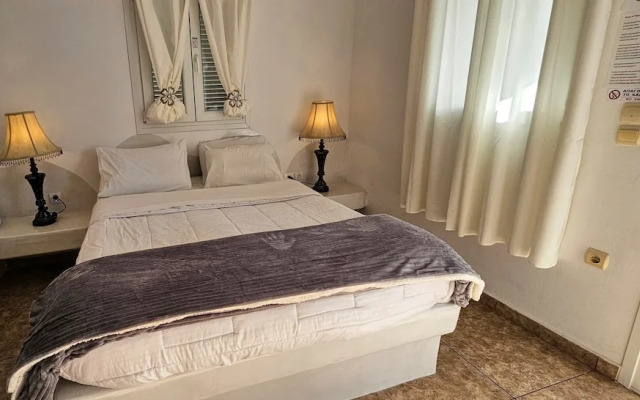 Santorini Studios Pleasure By The Sea