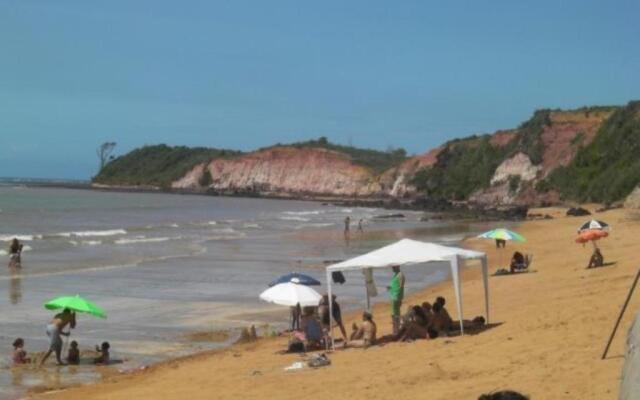 Casa de praia de frente para o mar com piscina