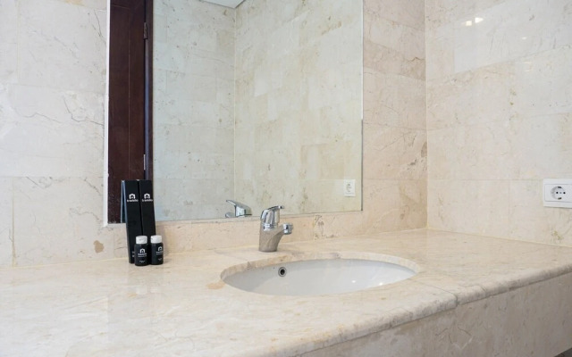 Cozy 2BR at Empyreal Epicentrum Apartment By Travelio