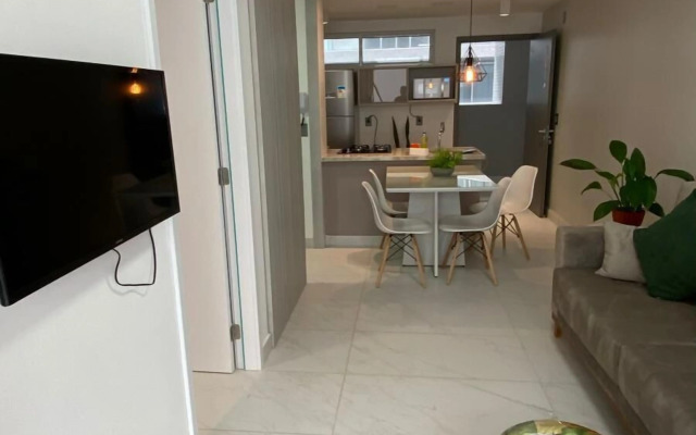 Pé na areia do Caribessa - Branco Haus