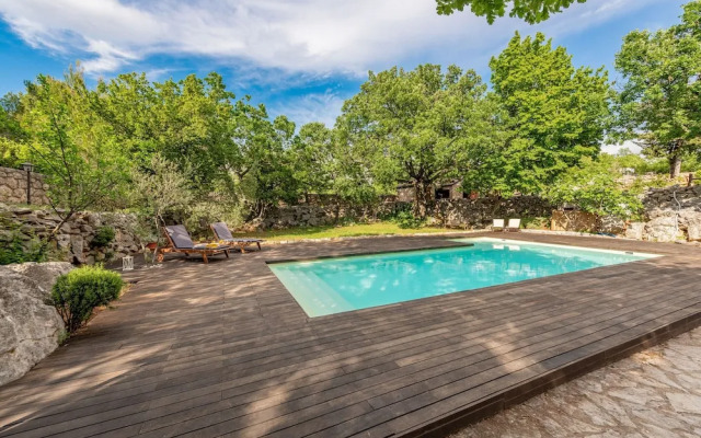Stone house M&A with pool