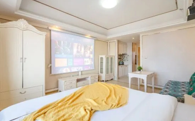 Ganghui Four Seasons Hotel Apartment (Dalian Railway Station Zhongshan Square)