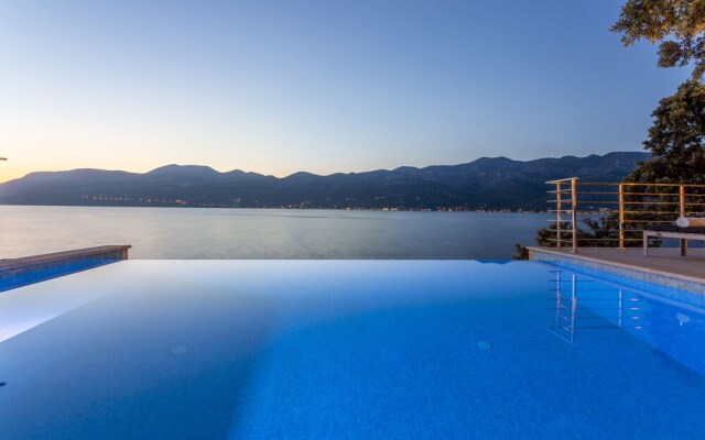 Beachfront Villa Poseidon with Heated Pool