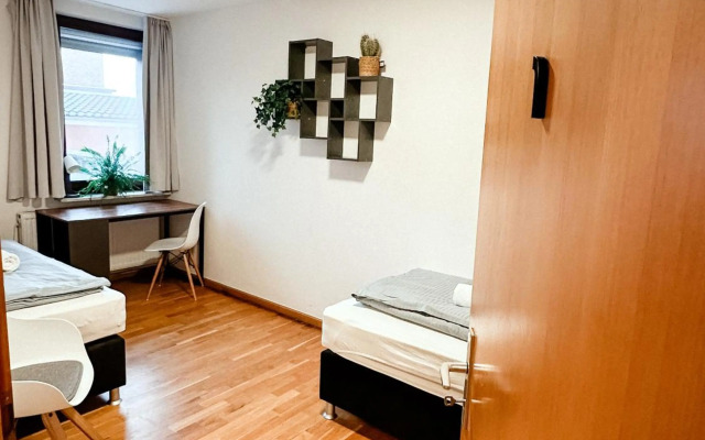 Suiteable Living - Boardinghaus mit Parkplätzen, WLAN und Waschraum