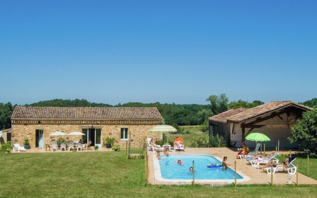 Lovely holiday home in Biron with fenced swimming pool