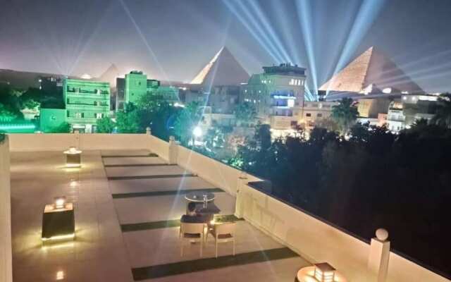 Nefertiti Pyramids View
