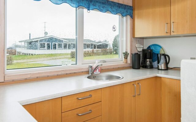 5 person holiday home on a holiday park in Glesborg