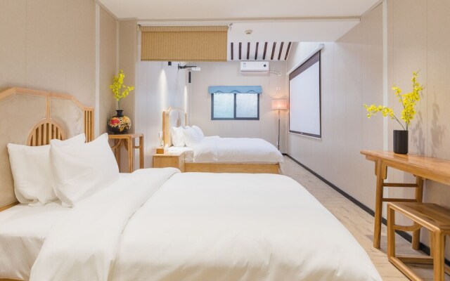 Floral Hotel Yi Shu Yu She Zhouzhuang