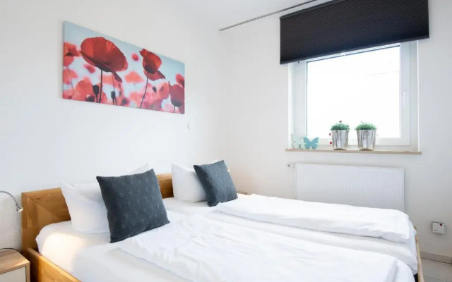 Badeweg 4 Sandkorn 1