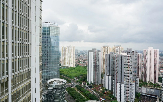 Cozy 2BR at Empyreal Epicentrum Apartment By Travelio