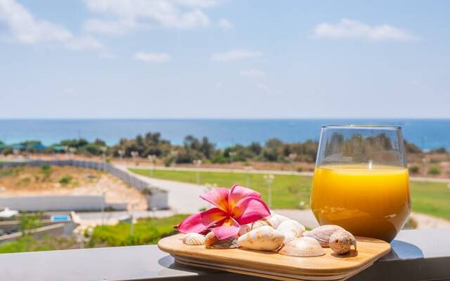 Vibrant Seaside Stay with Balcony by Sea N' Rent
