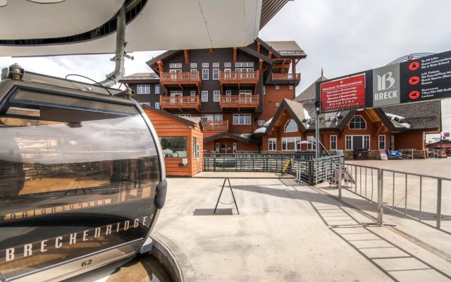 Expansive 4 Bedroom Ski in, Ski out One Ski Hill Residence Located at the Base of Peak 8 with Beautiful Views