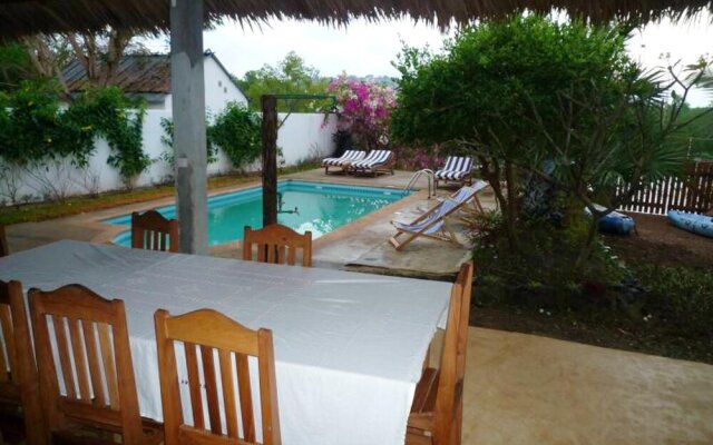 Bungalow With 2 Bedrooms in Andilana, With Wonderful sea View, Shared Pool and Enclosed Garden