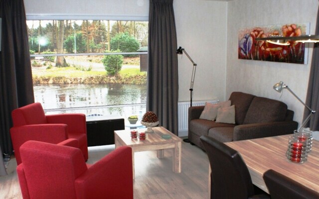 Modern chalet with two terraces and near a pond