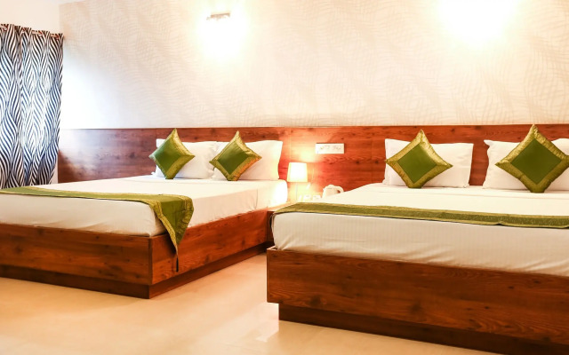 Treebo Comforts Inn, University Road Deralakatte