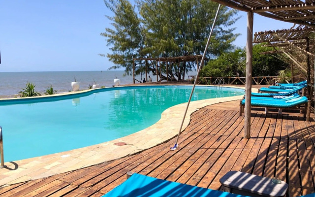 Saadani Safari Lodge - bush, river, beach