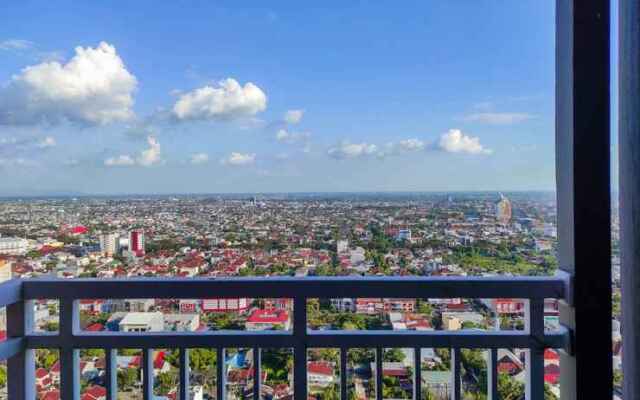 Comfy and Homey 2BR at Vida View Apartment By Travelio