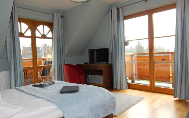 Domek za Strugiem - pokoje i apartamenty