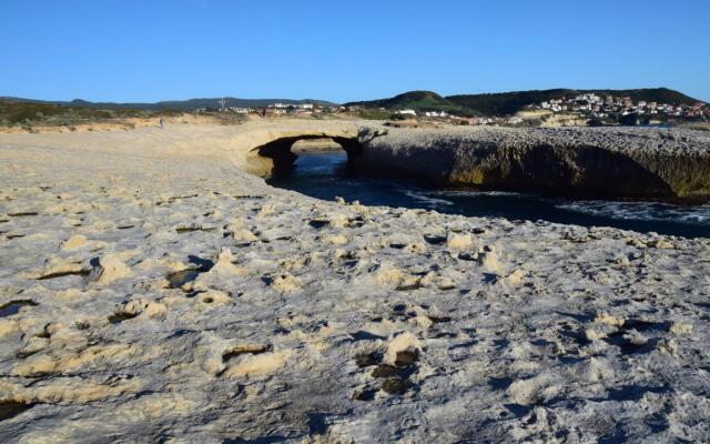 Seafront holiday home twenty meters from the western shore of Sardinia in S'archittu Beach-Casa del Giglio
