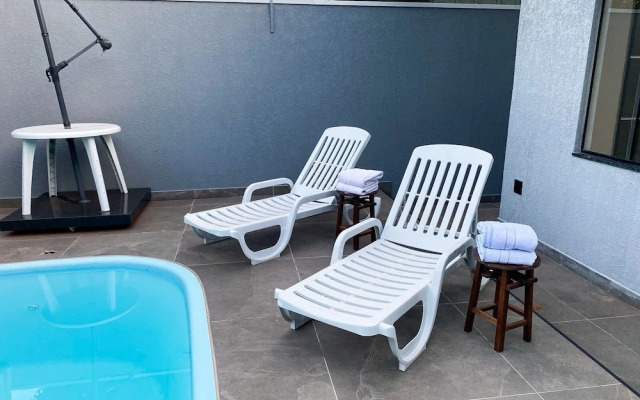 Casa Central piscina e AC para 8 hospede