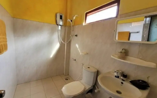 Malika's Yellow House