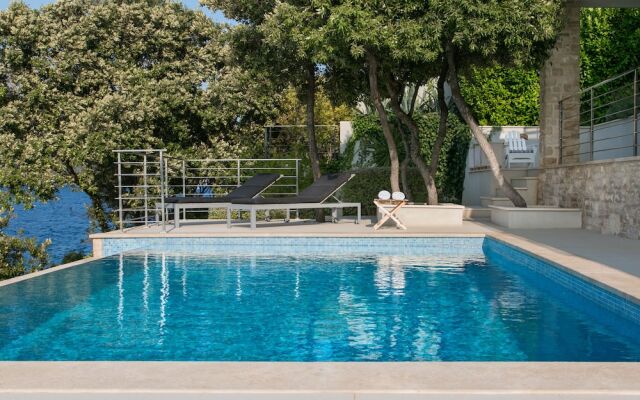 Beachfront Villa Poseidon with Heated Pool