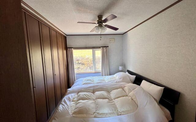 Yellow House by Lake Toya