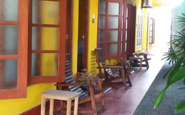 Malika's Yellow House