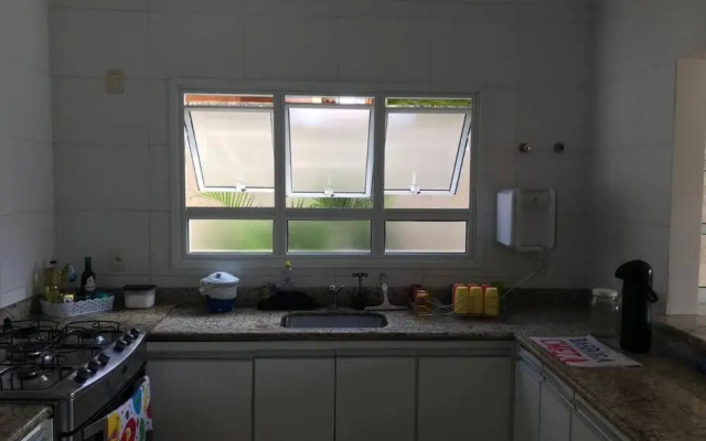 Casa de praia com piscina e churrasqueira - Indaiá Bertioga