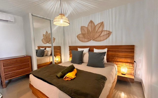 Le Baileys - Spacieux appartement en rez-de-jardin vue lagon