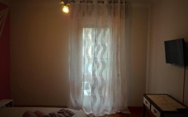 "room in Guest Room - Camera Rosa Appartamento Quadrifoglio"