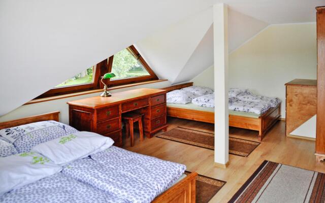 Holiday Home by Lake Rosnowskie With Boat