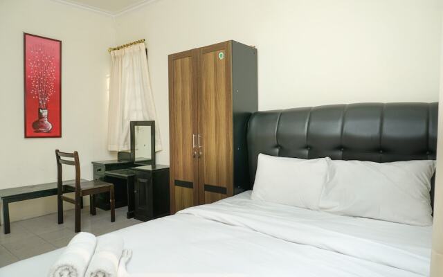 Clean and Homey 1BR at Puri Garden Apartment