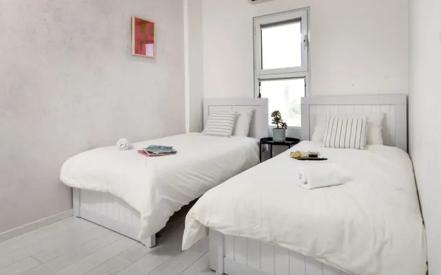 Modern Gem with Stunning Balcony by Sea N Rent