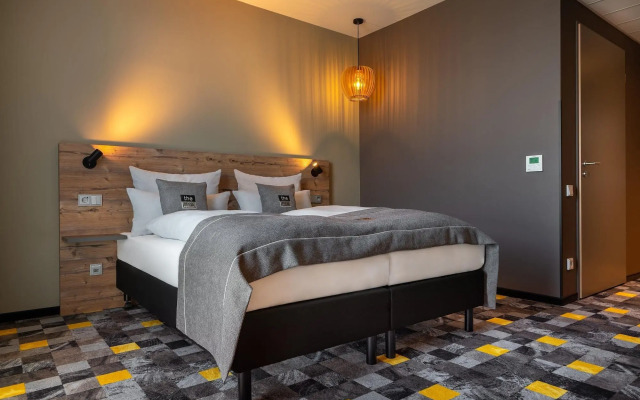 Отель Holiday Inn - the niu, Timber Esslingen, an IHG Hotel