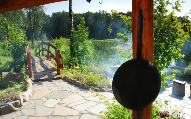 Rustic Riverside Cabin in Forest