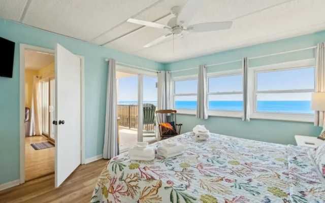 Oceanfront Beach Condo with Private Balcony, Short Walk to Pool and Beach by RedAwning