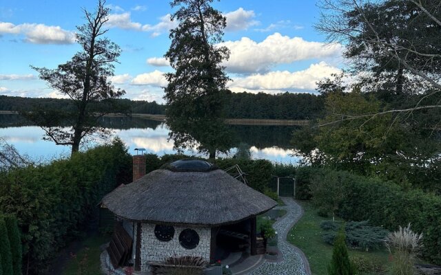 A Luxury Home on the Shore of the Lake. Living Room With Fireplace, 2 Bedrooms