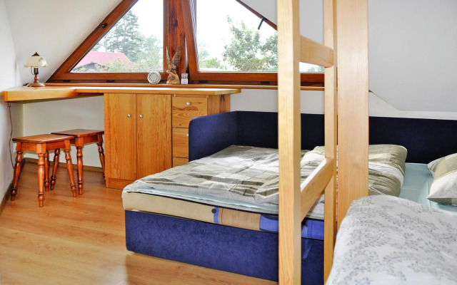 Holiday Home by Lake Rosnowskie With Boat