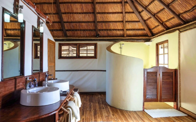 Saadani Safari Lodge - bush, river, beach
