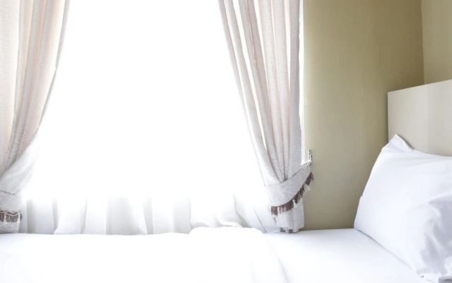 Comfortable 2Br Apartment at Grand Asia Afrika Residence Near Alun Alun Bandung by Travelio – Guest Rooms – Bandung