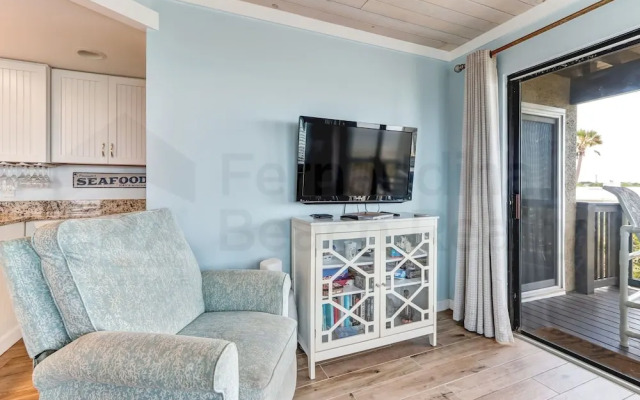Newly Remodeled Oceanfront Condo with Salt Water Pool and Private Walkway to Beach by RedAwning