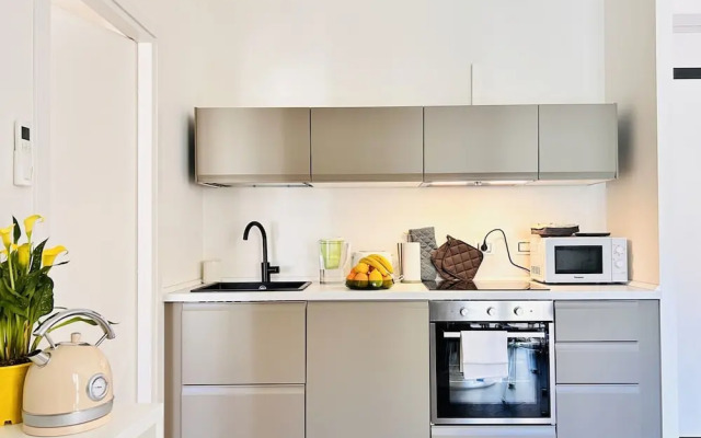 Moderno Bilocale con Terrazzo e Parcheggio