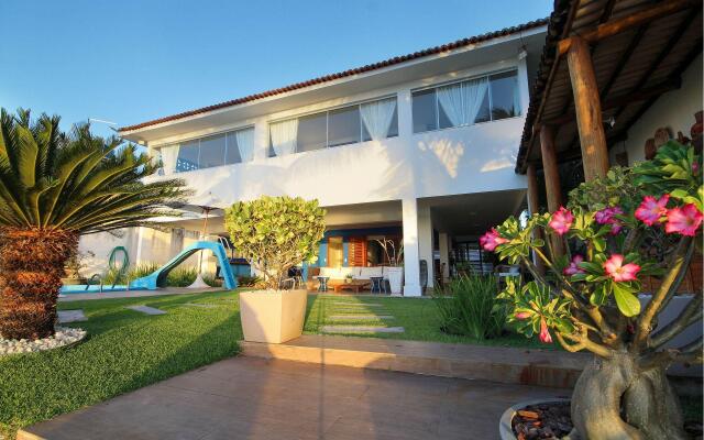 Casa pé na areia na Praia de Genipabu by Carpediem