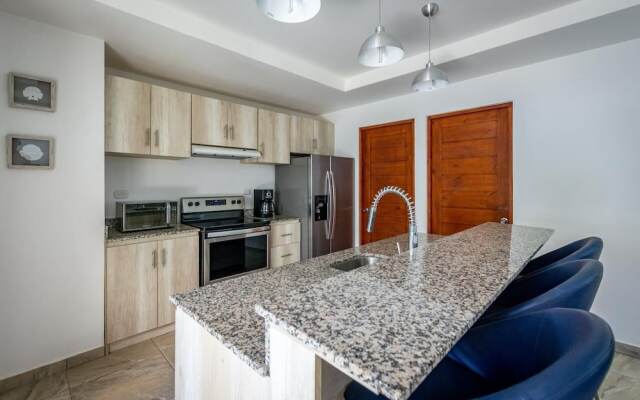 Ultramodern Townhome with an Inviting Coastal Design and Lush Outdoor Oasis with a Private Pool