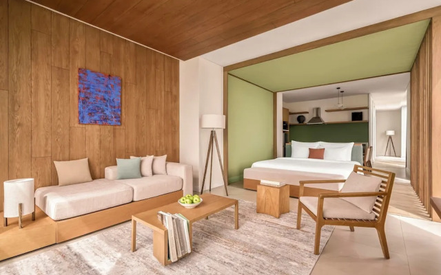 Signature By M Village Beachfront Hotel