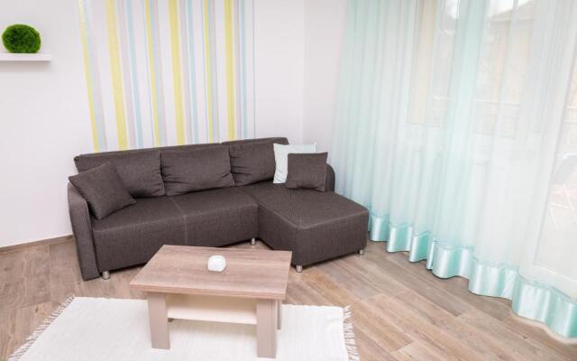 Aqualiget-Apartmanház