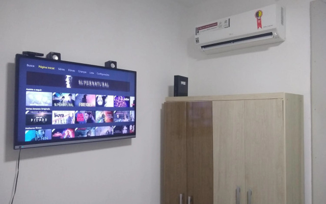 Quarto aconchegante em Apê, no Calçadão