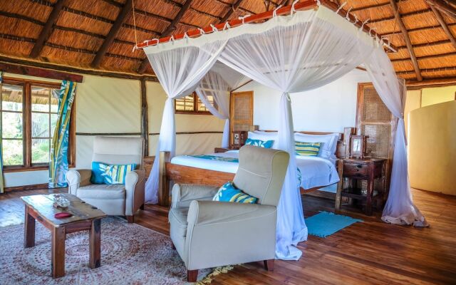 Saadani Safari Lodge - bush, river, beach